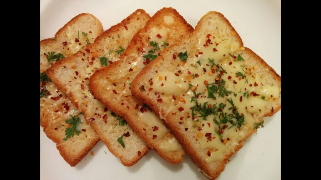 Freshly baked garlic breads served hot with melted butter and herbs